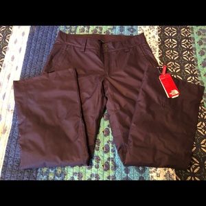 The North Face Woman’s ski pants in eggplant color